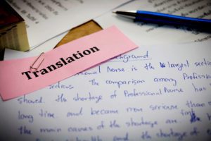 A handwritten translated document with translation errors marked